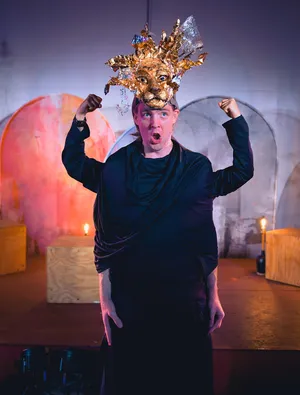 Robin McGinness in Alceste (In Series) — gold lion headdress, mock flex